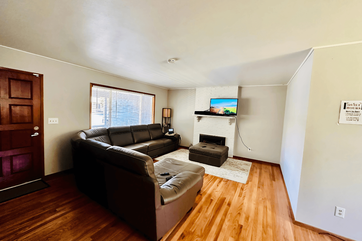 Comfortable living area with cozy seating, natural light, and a calm atmosphere for relaxation.